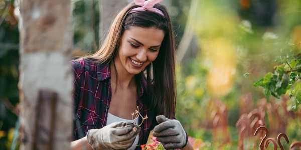 woman gardening and smiling